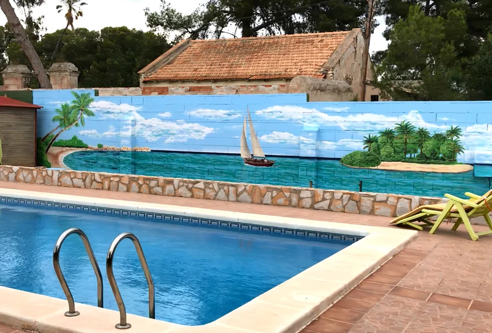 mural-exterior-pintado-a-mano-motivo-maritimo-barco-isla